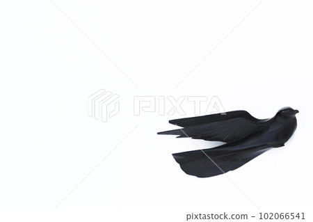 A small wooden bird flying freely in the sky A small wooden bird flying freely in the sky 102066541