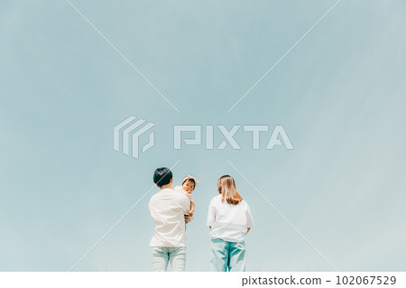 family standing along the bank 102067529