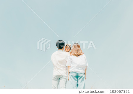 family standing along the bank 102067531