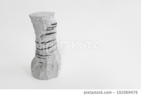 The sculptural shape of the test piece left after the reinforced concrete compressive strength test The sculptural shape of the test piece left after the reinforced concrete compressive strength test 102069478