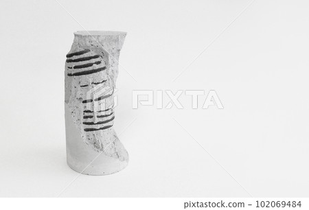 The sculptural shape of the test piece left after the reinforced concrete compressive strength test The sculptural shape of the test piece left after the reinforced concrete compressive strength test 102069484