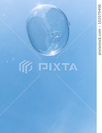 Landscape with one soap bubble floating against the blue sky 102070406