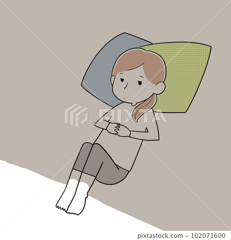 A woman lying in a dark room A woman lying in a dark room 102071600