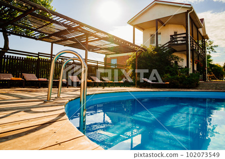 A handrail for pool stairs is an important safety feature in a swimming pool. 102073549