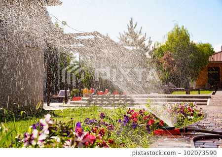 Automatic watering system on the lawn. watering heads and pipes  102073590