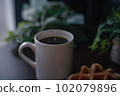 coffee and waffles by the window 102079896
