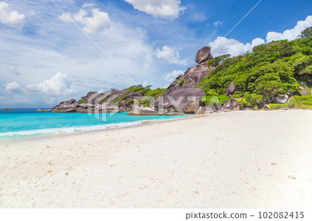 sandy beach with wave crashing on sandy shore at Similan Islands Thailand sandy beach with wave crashing on sandy shore at Similan Islands Thailand 102082415