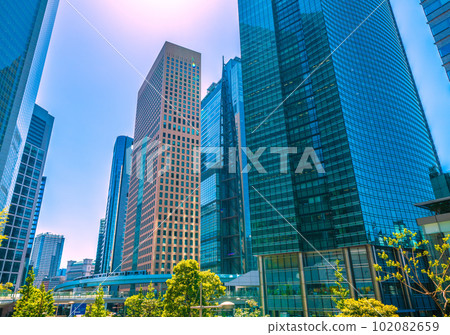Tokyo cityscape in Japan It's sunny like summer. A view of the Shiodome office district and the Yurikamome Line (back of the image) = April 102082659
