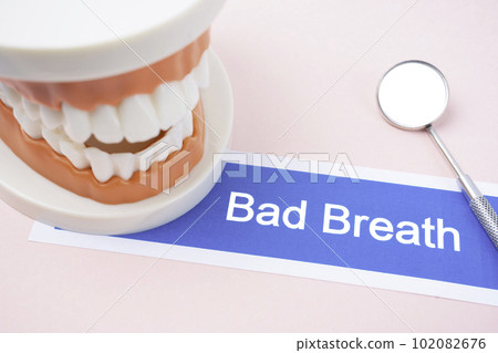 The Teeth model with Bad Breath dental disease on pink color background. 102082676