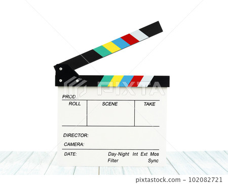 The Film slate or Flying clapperboard on wooden table isolated on white background, Save clipping path. 102082721