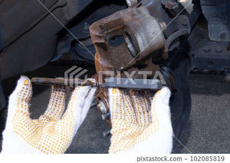 Car brake pad replacement work New and old brake pads Car brake pad replacement work New and old brake pads 102085819
