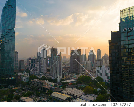 Aerial view office city building with Mahanakorn building sunset Aerial view office city building with Mahanakorn building sunset 102087237