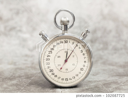 Old stopwatch on a gray background Old stopwatch on a gray background 102087725