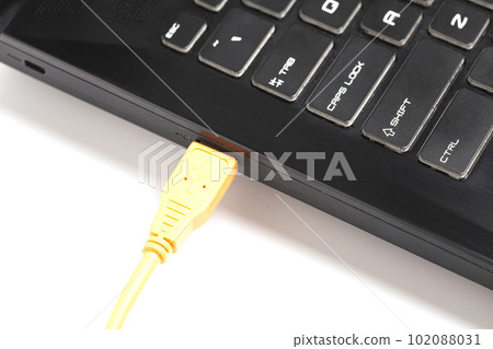 laptop with USB orange cable. 102088031