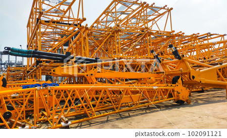 A stack of crane boom, lower section, middle section, upper section, and crane fly jib. A stack of crane boom, lower section, middle section, upper section, and crane fly jib. 102091121