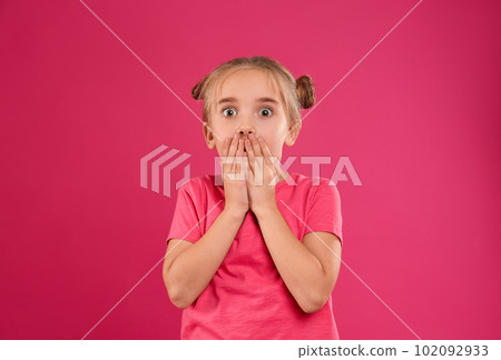 Cute little girl posing on pink background Cute little girl posing on pink background 102092933