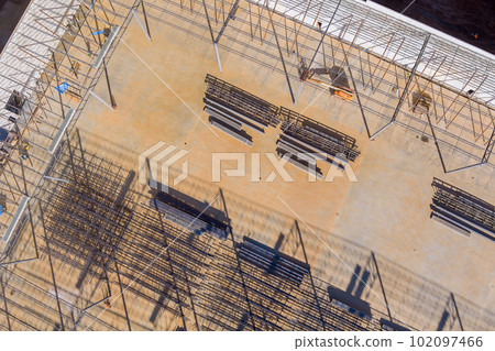 Construction of metal trusses frame for steel warehouse work on construction site 102097466