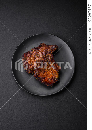 Delicious beef or pork steak on the bone grilled with spices and rosemary 102097487