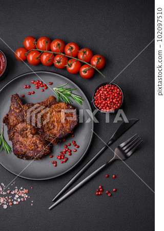 Delicious beef or pork steak on the bone grilled with spices and rosemary 102097510