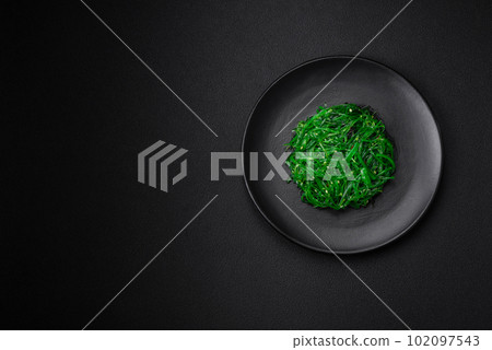 Delicious healthy vegetarian hiashi wakume seafood salad with sesame seeds 102097543