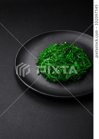 Delicious healthy vegetarian hiashi wakume seafood salad with sesame seeds 102097545