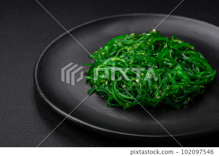 Delicious healthy vegetarian hiashi wakume seafood salad with sesame seeds 102097546