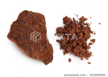 Dark muscovado sugar or Barbados sugar isolated on white background. Top view. Flat lay 102099480