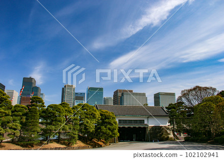 Spring in Tokyo: Seimon Ishibashi and the Tokyo Station Buildings viewed from the Nijubashi Bridge in the Imperial Palace; A fusion of history and modernity 102102941