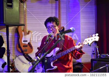 Blues band bassist playing in a live house Blues band bassist playing in a live house 102111355