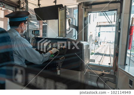 Asian male train driver on workplace, view from behind 102114949
