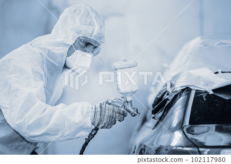 car painting with high detail paint professional quality work in garage auto color repair workshop vintage color tone. 102117980