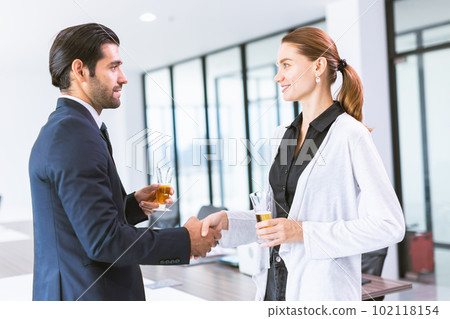 business people meeting introduce hand shaking in alcohol drink office party 102118154