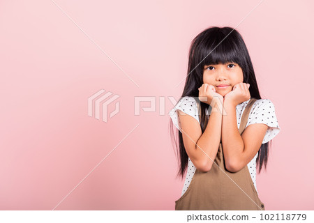Asian little kid 10 years old hands touch chin thinking dream at studio shot isolated on pink background, Portrait of Happy child girl positive smiling rejoices good day with lover Asian little kid 10 years old hands touch chin thinking dream at studio shot isolated on pink background, Portrait of Happy child girl positive smiling rejoices good day with lover 102118779