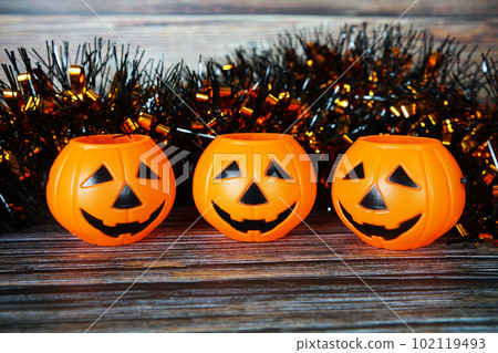 Halloween Pumpkin bucket  with space copy on wooden background 102119493