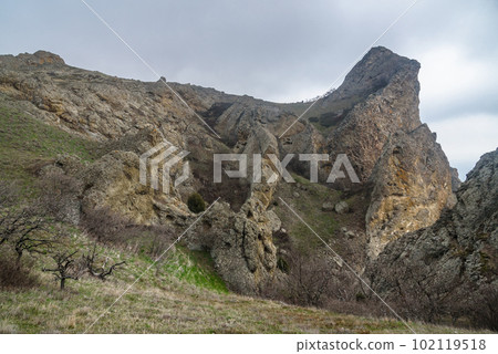 Landscape of Karadag Reserve in spring. View of rocks of ridge Karagach. Crimea Landscape of Karadag Reserve in spring. View of rocks of ridge Karagach. Crimea 102119518