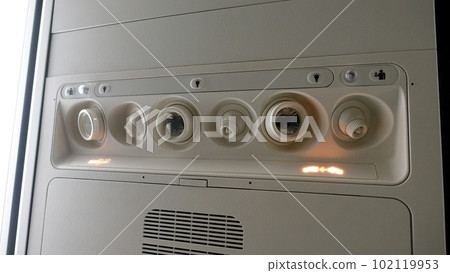 Detail of the ceiling of the interior of an airplane. Detail of the ceiling of the interior of an airplane. 102119953