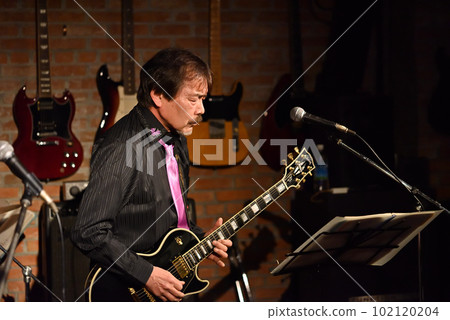 Vocals of a blues band performing at a live house Vocals of a blues band performing at a live house 102120204