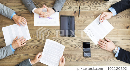 Business team discuss contract terms Business team discuss contract terms 102120892