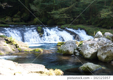 small waterfall in the valley 102121057