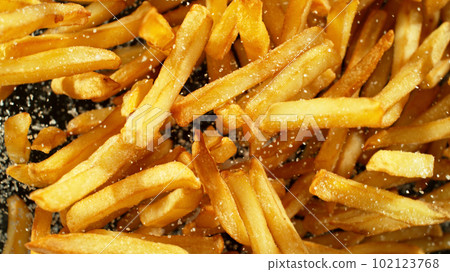 French fries - fried potatoes flying. 102123768