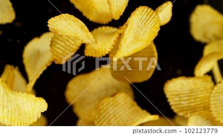 Potatoes chips flying up in the air. Potatoes chips flying up in the air. 102123779