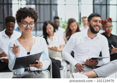 people sitting in business seminar room in hotel business 102129476
