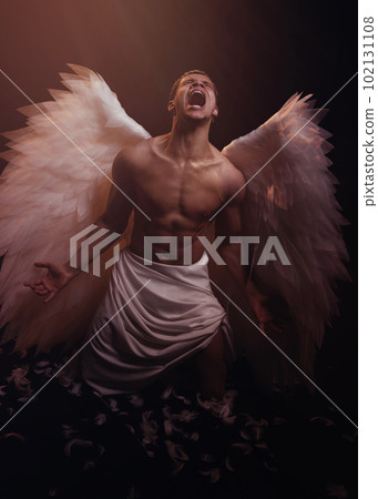 Young strong angel with white wings from heaven. Angel with muscular body. Sensual man 102131108