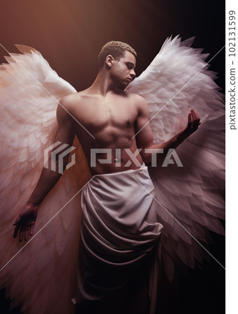 Young strong angel with white wings from heaven. Angel with muscular body. Sensual man Young strong angel with white wings from heaven. Angel with muscular body. Sensual man 102131599