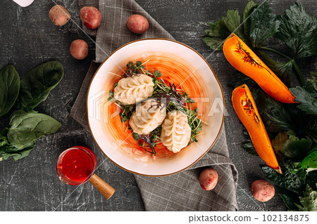 Portion of manti dumplings stuffed with pumpkin Portion of manti dumplings stuffed with pumpkin 102134875