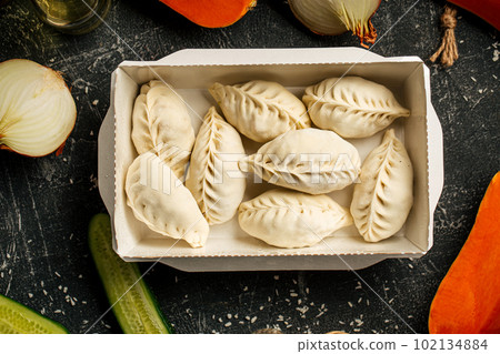 Portion of semi finished oriental manti dumplings Portion of semi finished oriental manti dumplings 102134884