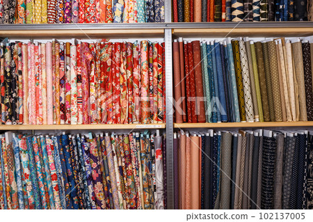 Fabric bolts on shop shelves Fabric bolts on shop shelves 102137005