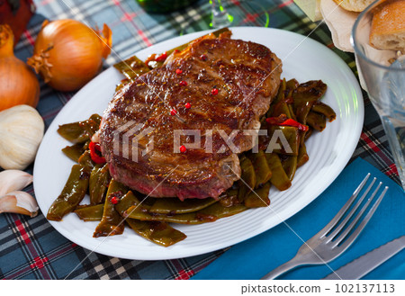 Steak beef with stewed green beans and pepper Steak beef with stewed green beans and pepper 102137113