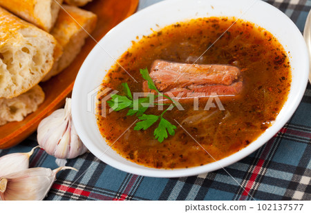 Shchi with pork in mushroom broth 102137577