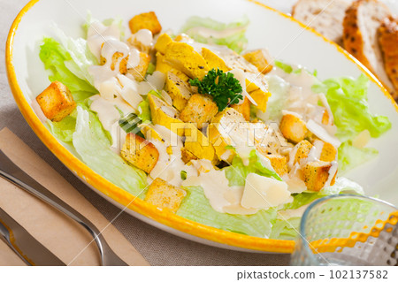 Fresh Caesar salad with chicken Fresh Caesar salad with chicken 102137582